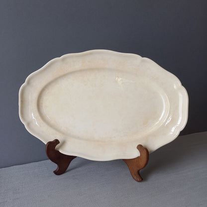 Vintage oval serving plate or platter in tea-stained creamy white colour by Villeroy & Boch