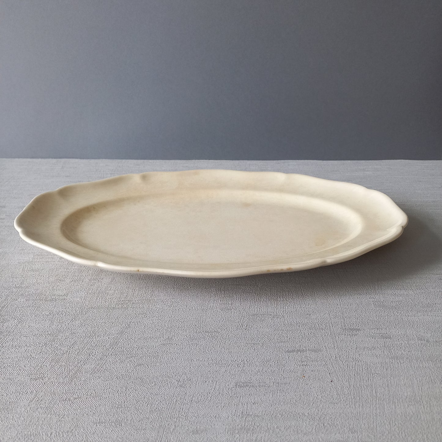 Vintage oval serving plate or platter in tea-stained creamy white colour by Villeroy & Boch