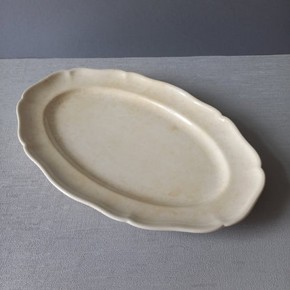 Vintage oval serving plate or platter in tea-stained creamy white colour by Villeroy & Boch