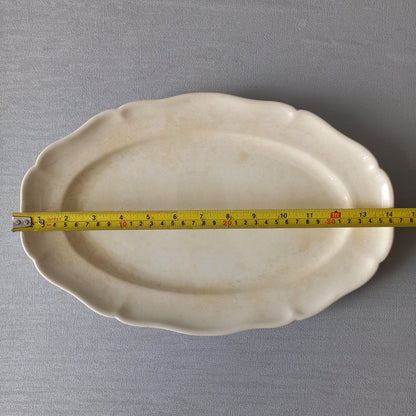 Vintage oval serving plate or platter in tea-stained creamy white colour by Villeroy & Boch