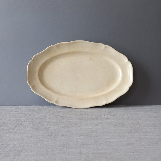 Vintage oval serving plate or platter in tea-stained creamy white colour by Villeroy & Boch