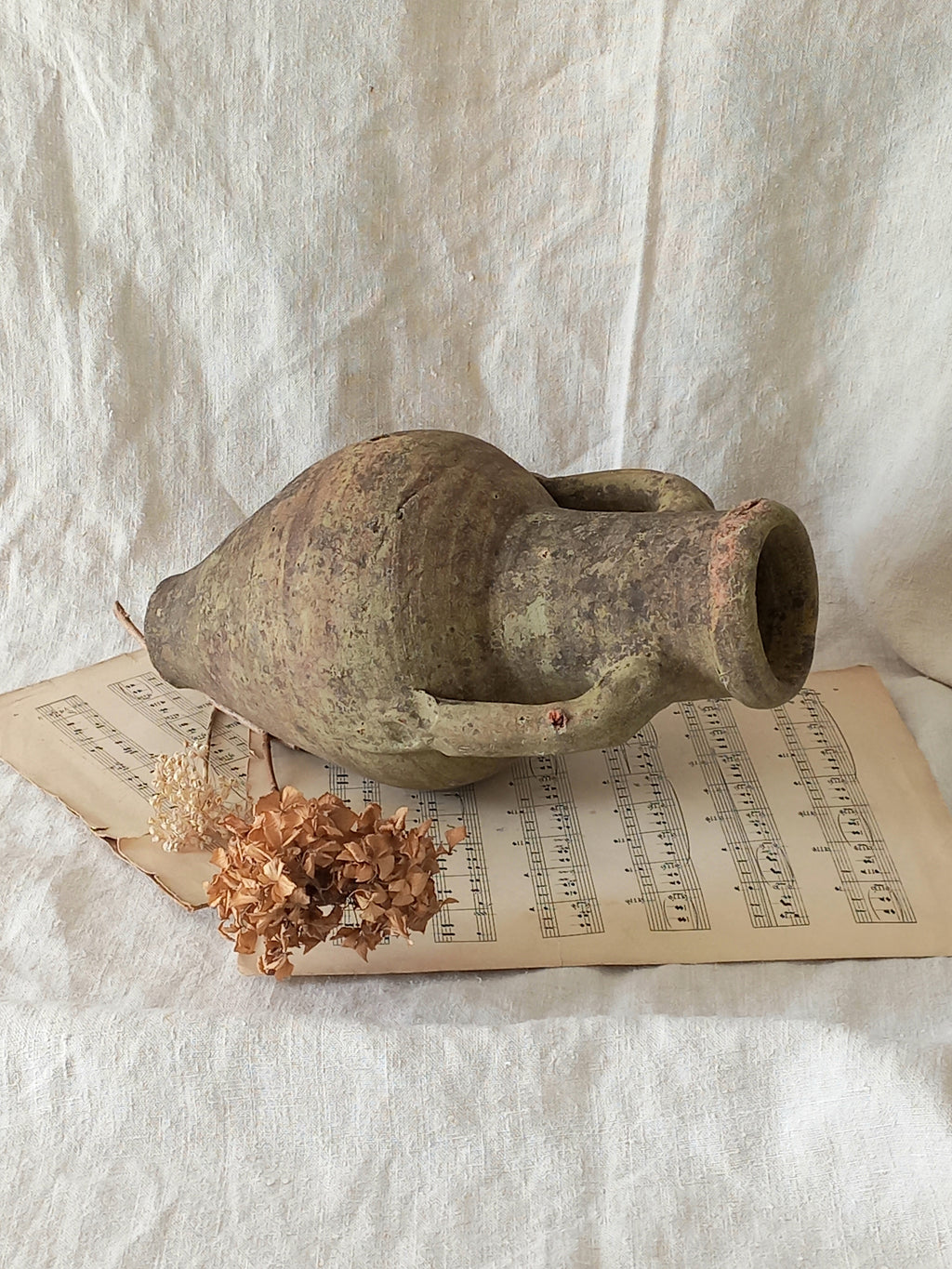 antique hand-made terracotta stoneware storage pot. With its ancient Greek inspired lines and rough texture it would make a absolutely beautiful piece of home decor in a rustic, farmhouse or country-inspired interior.