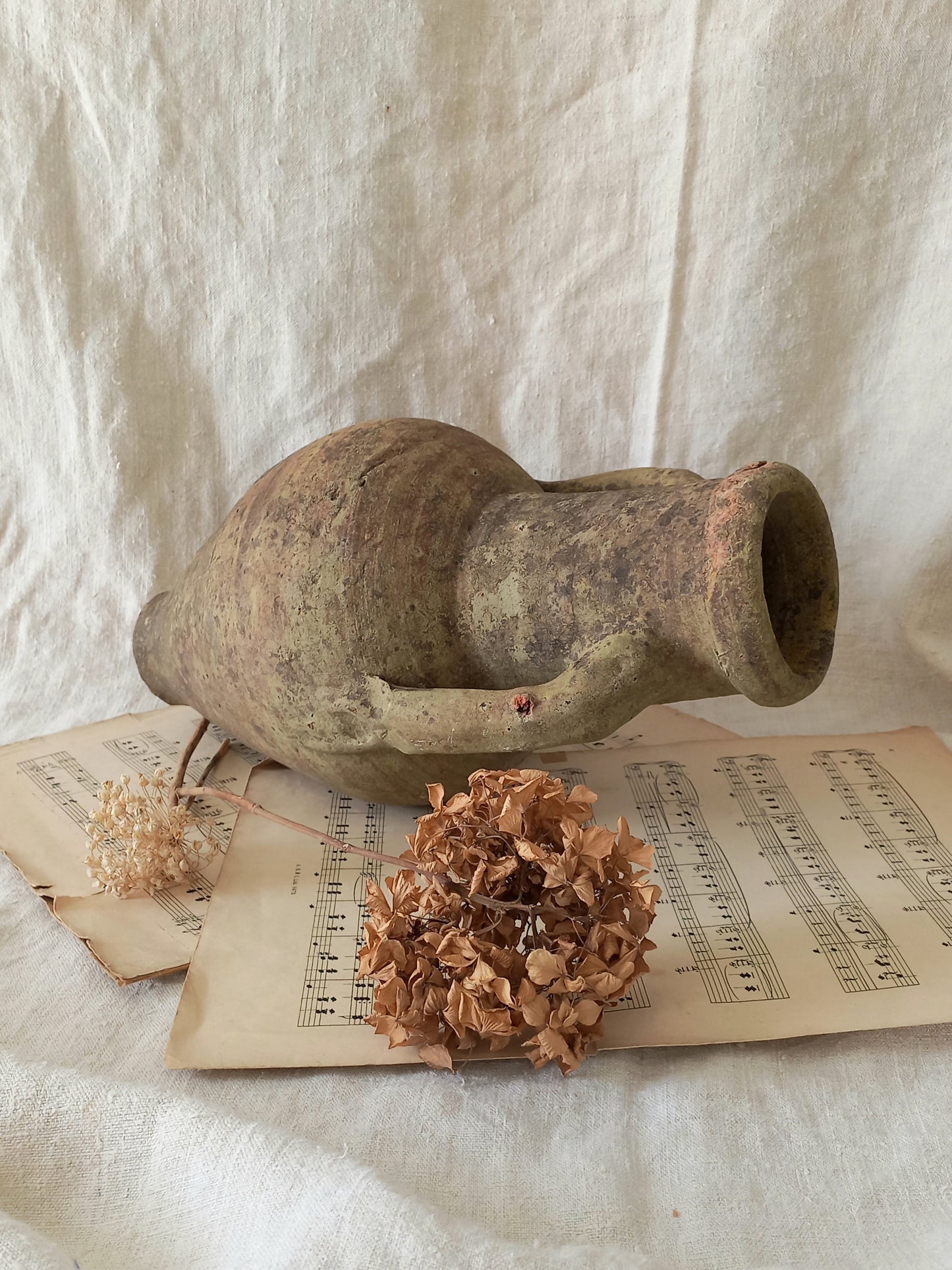 antique hand-made terracotta stoneware storage pot. With its ancient Greek inspired lines and rough texture it would make a absolutely beautiful piece of home decor in a rustic, farmhouse or country-inspired interior.
