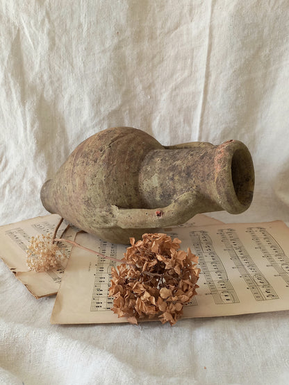 antique hand-made terracotta stoneware storage pot. With its ancient Greek inspired lines and rough texture it would make a absolutely beautiful piece of home decor in a rustic, farmhouse or country-inspired interior.