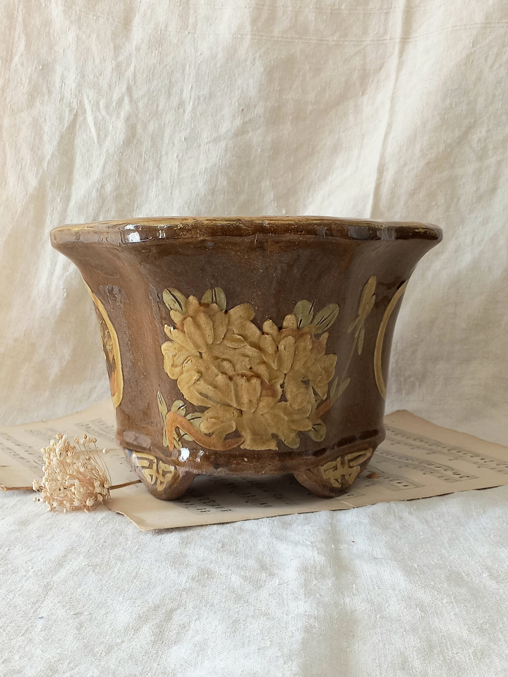 A stunning decorative glazed stoneware planter with oriental animal and floral design influences. 