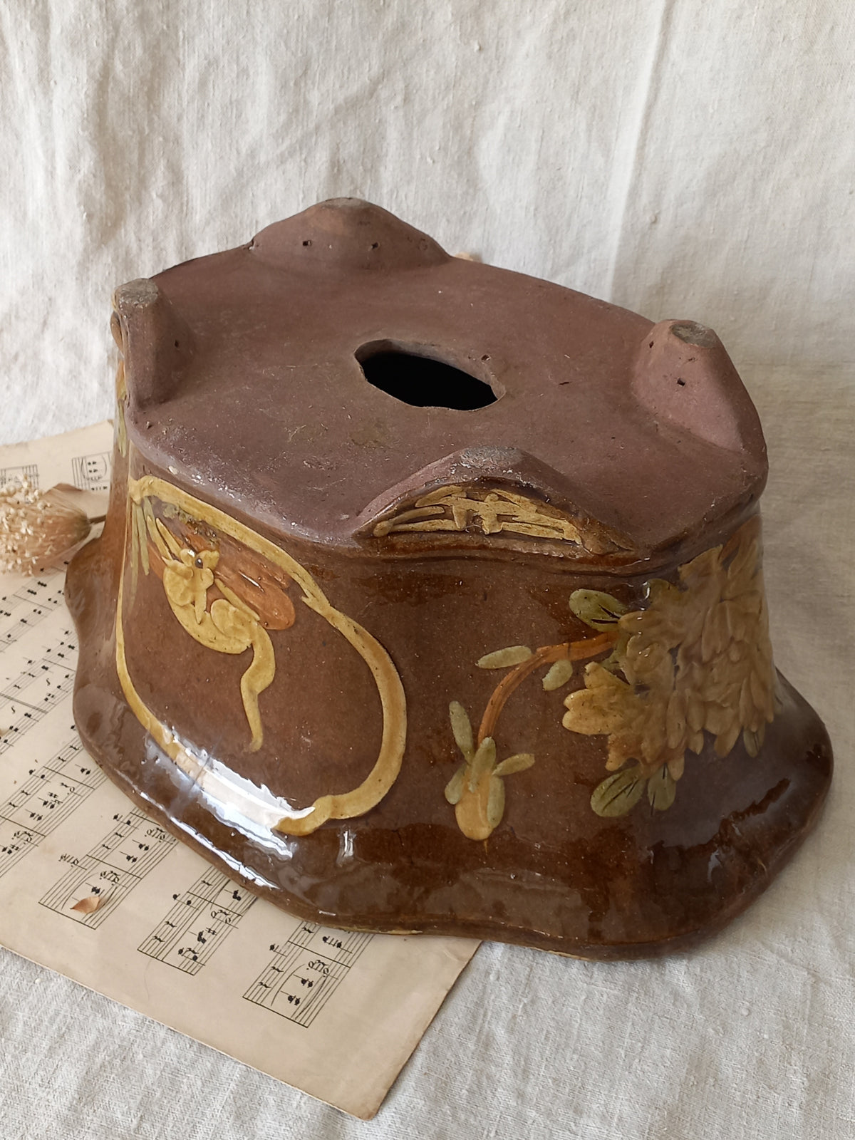 A stunning decorative glazed stoneware planter with oriental animal and floral design influences. 