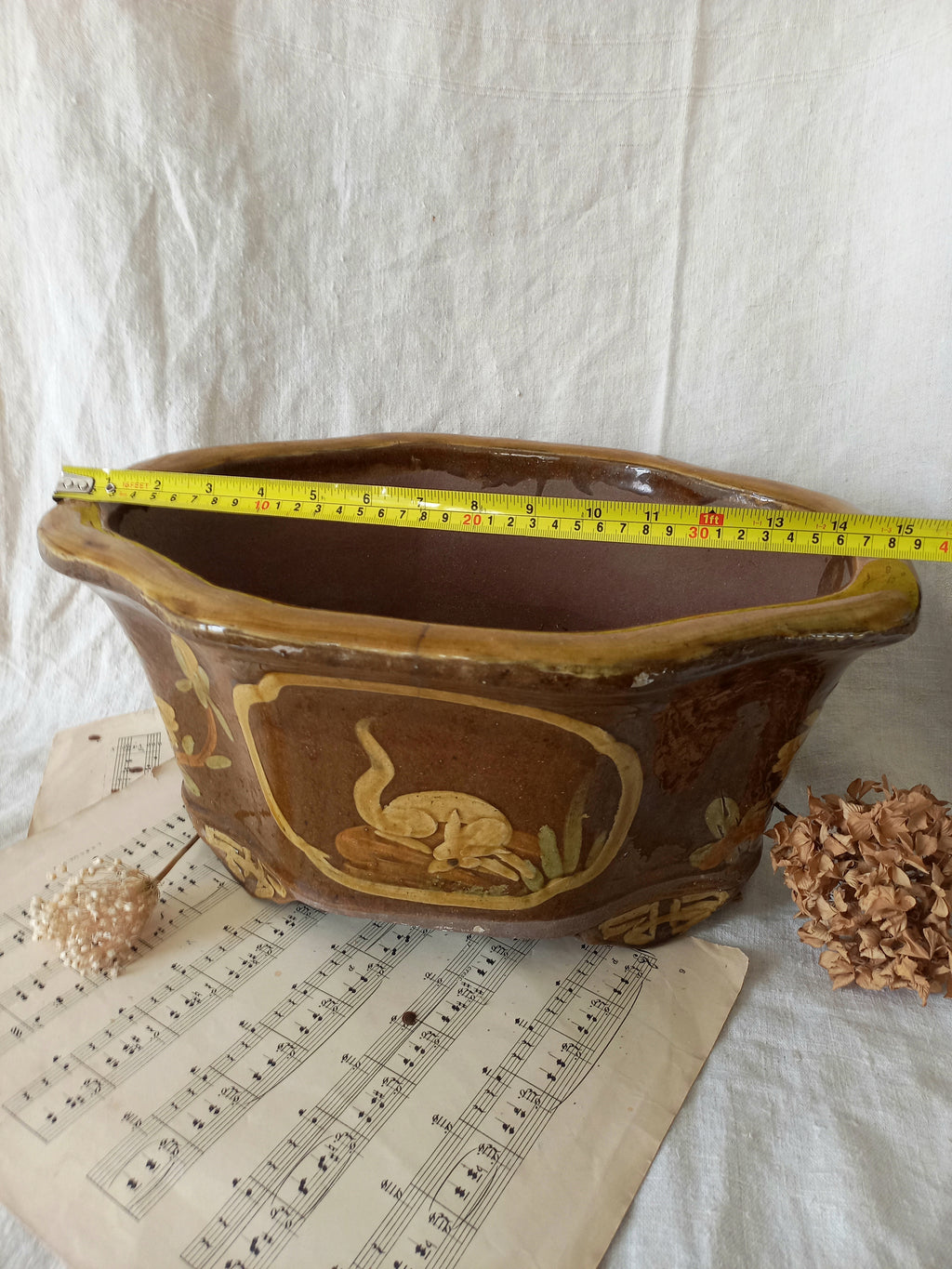 A stunning decorative glazed stoneware planter with oriental animal and floral design influences. 