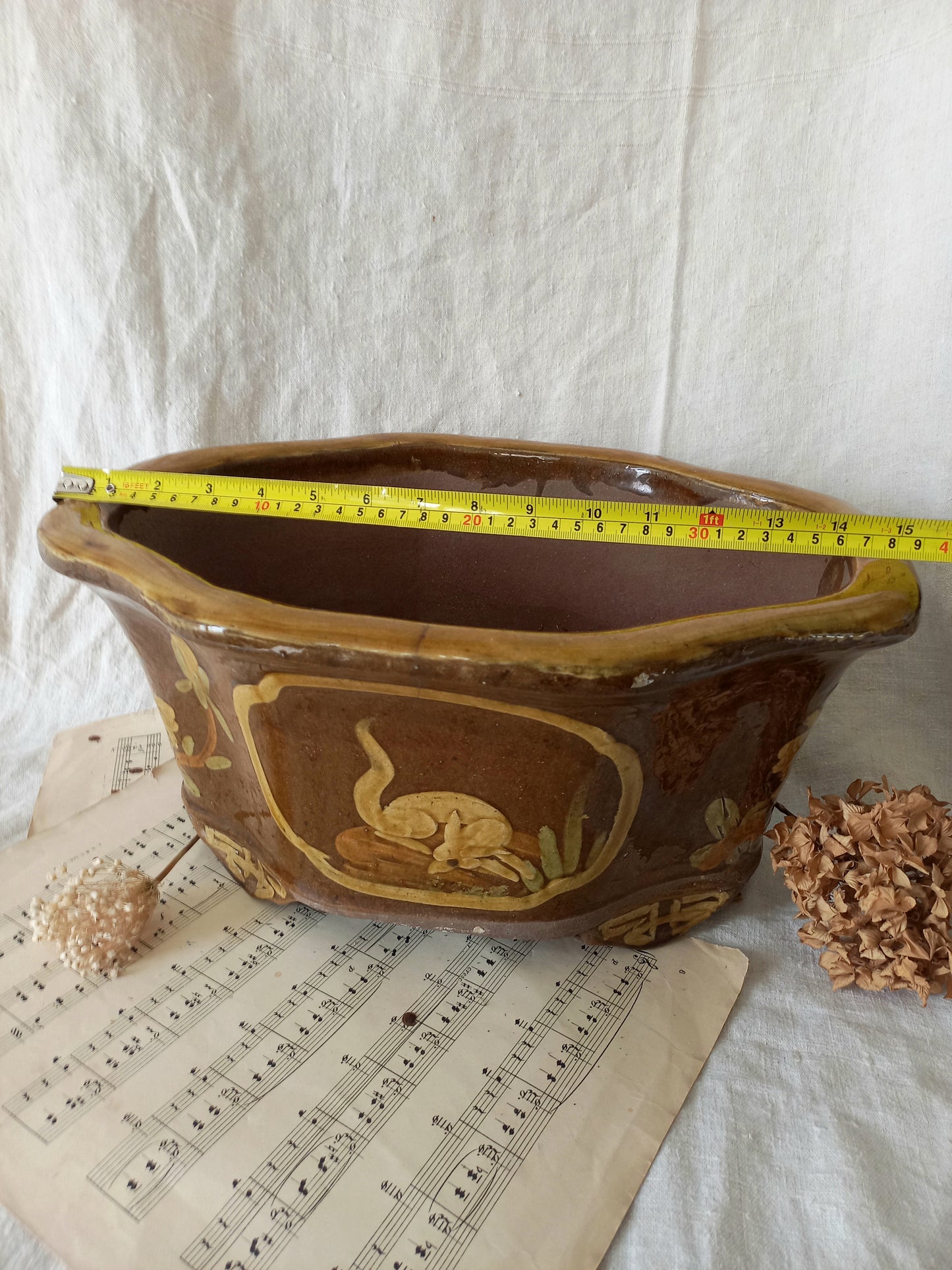 A stunning decorative glazed stoneware planter with oriental animal and floral design influences. 