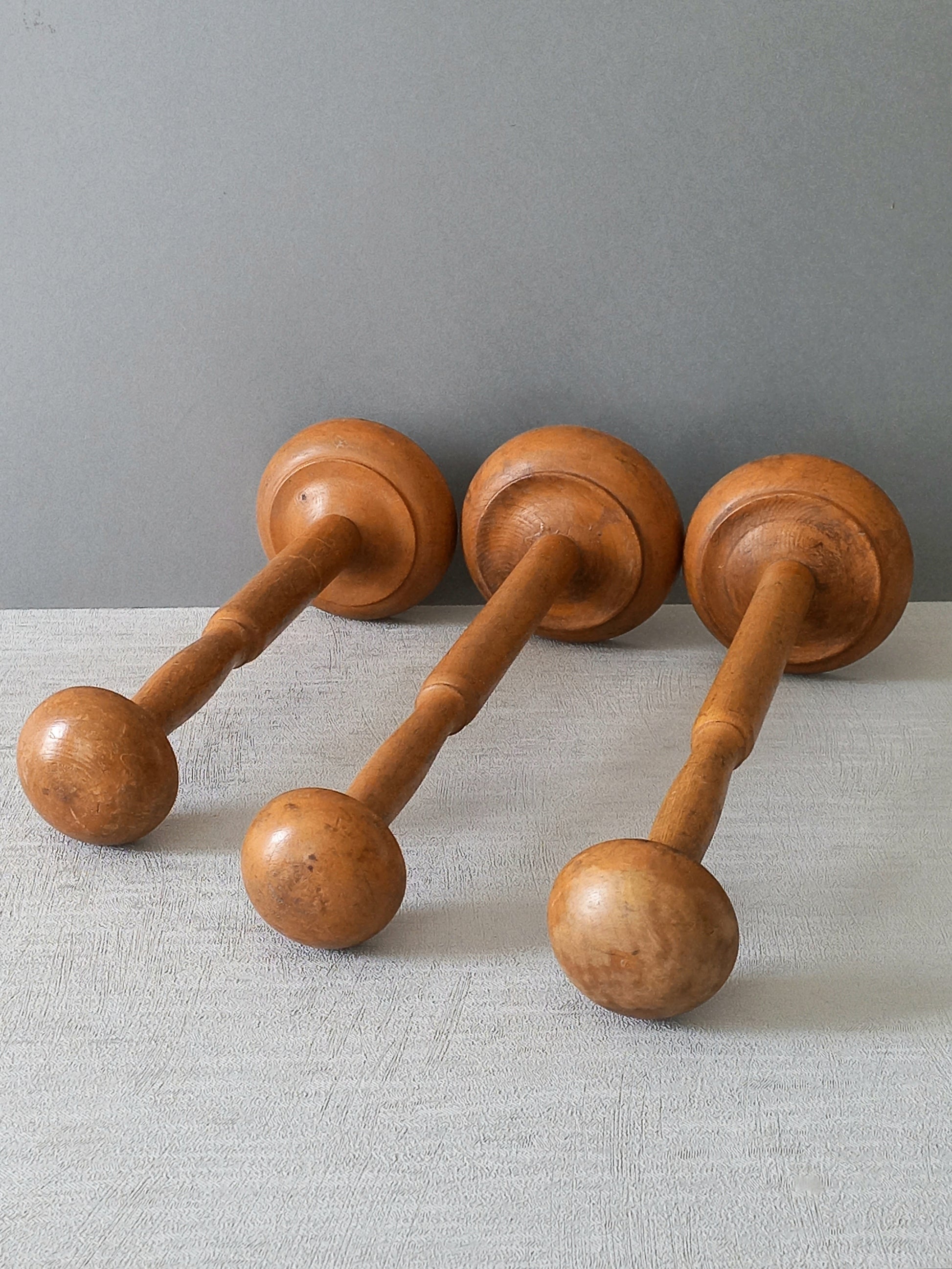 Three vintage wooden hat stands