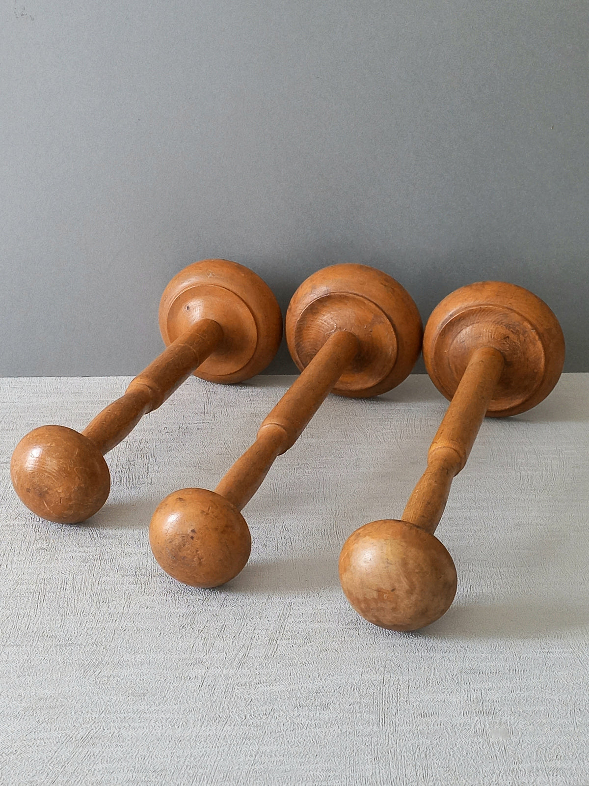 Three vintage wooden hat stands