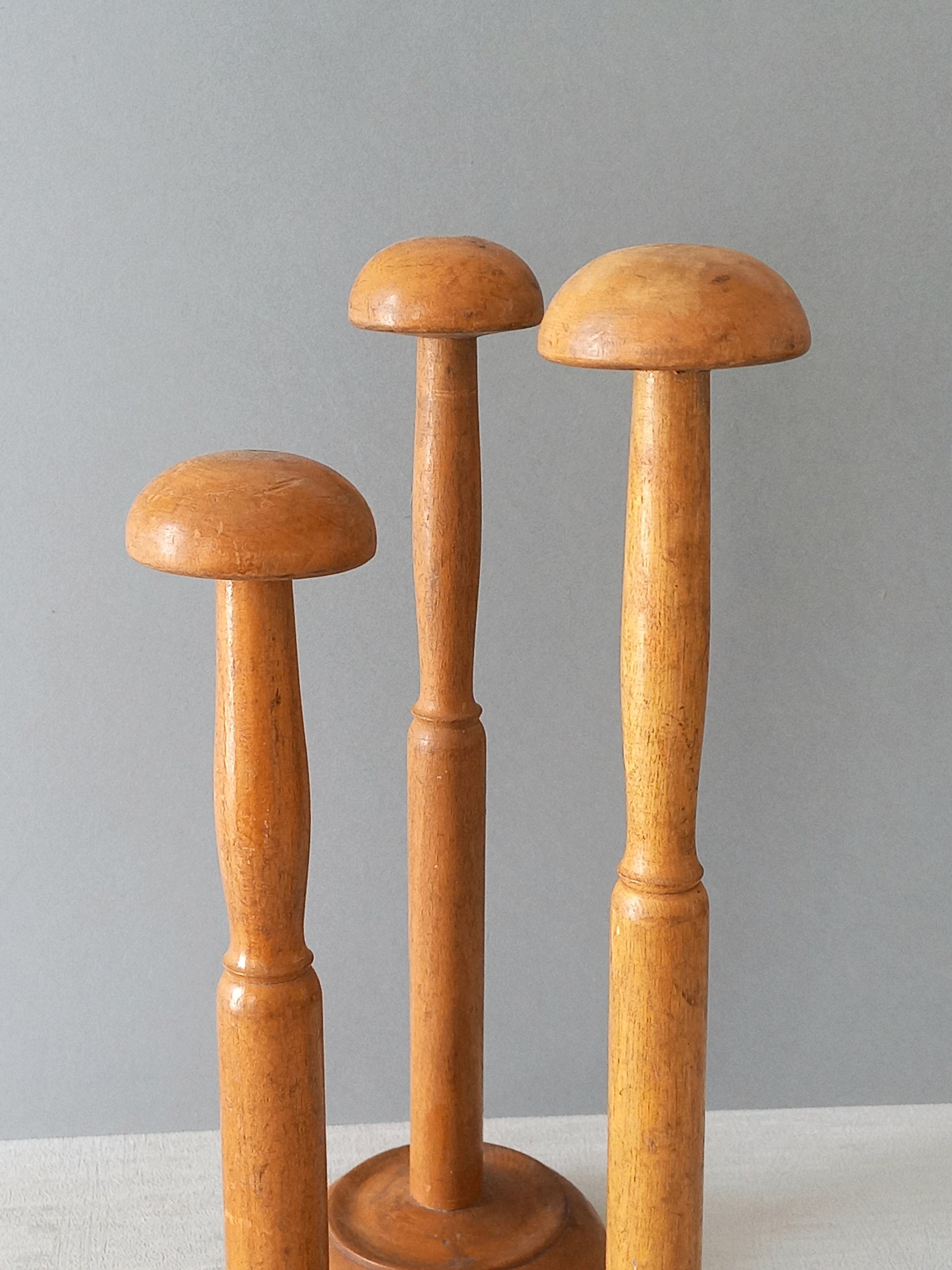 Three vintage wooden hat stands