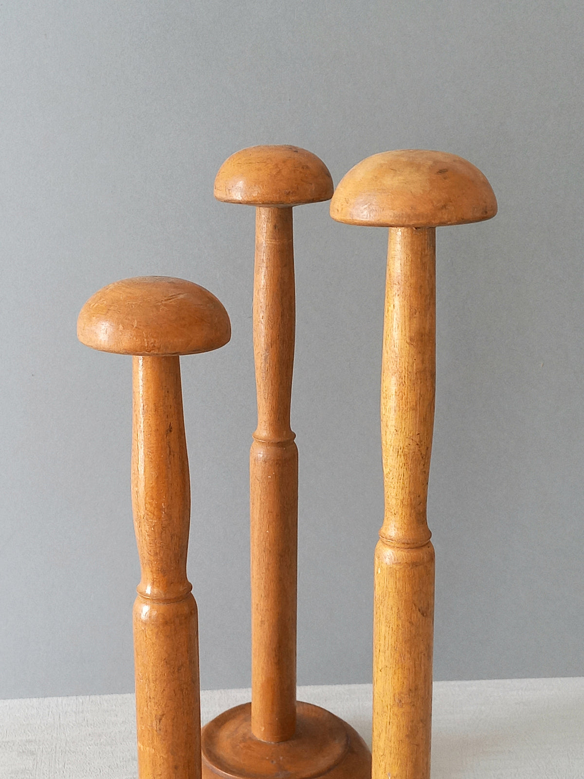 Three vintage wooden hat stands