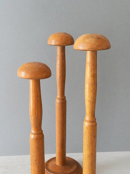 Three vintage wooden hat stands