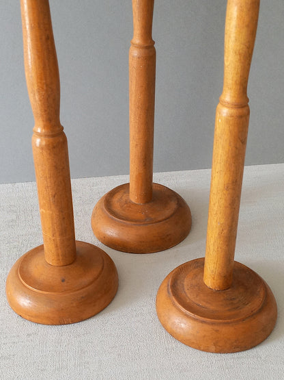Three vintage wooden hat stands