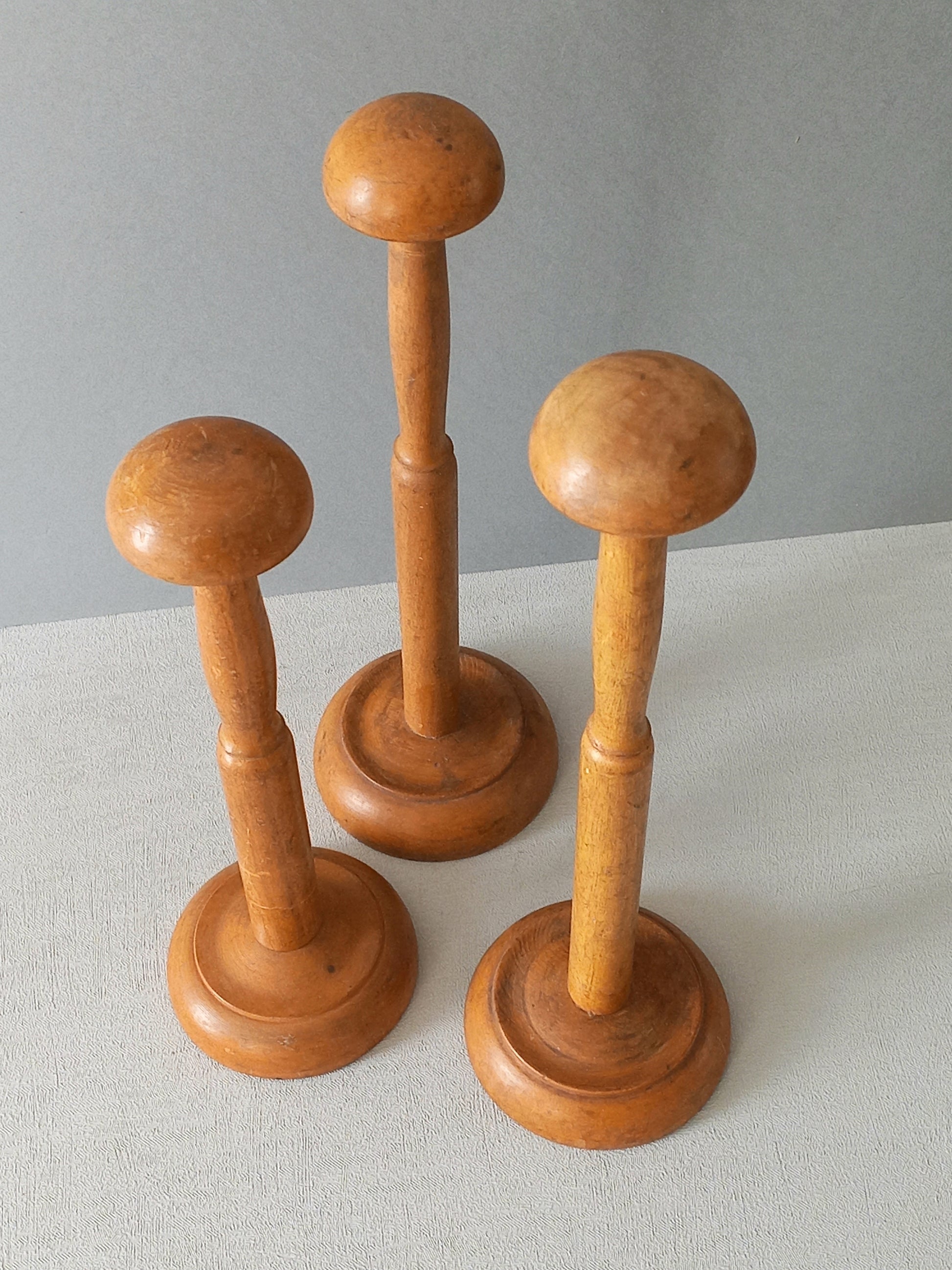 Three vintage wooden hat stands