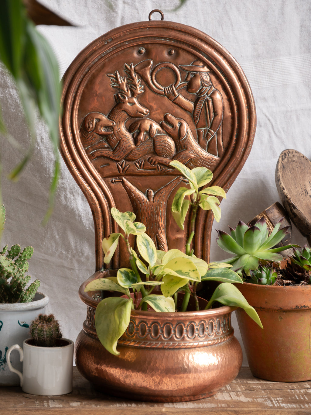 Copper vintage/antique wall-mounted planter with a hunting scene 