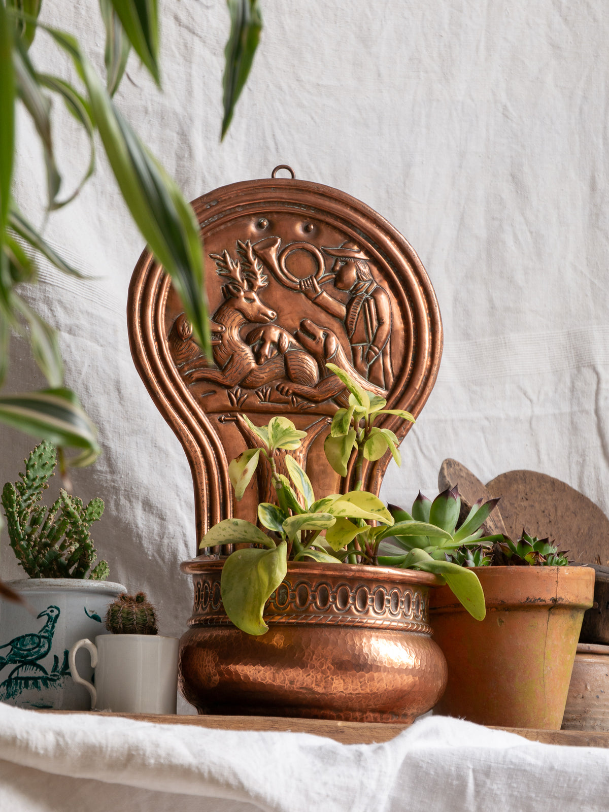 Copper vintage/antique wall-mounted planter with a hunting scene 