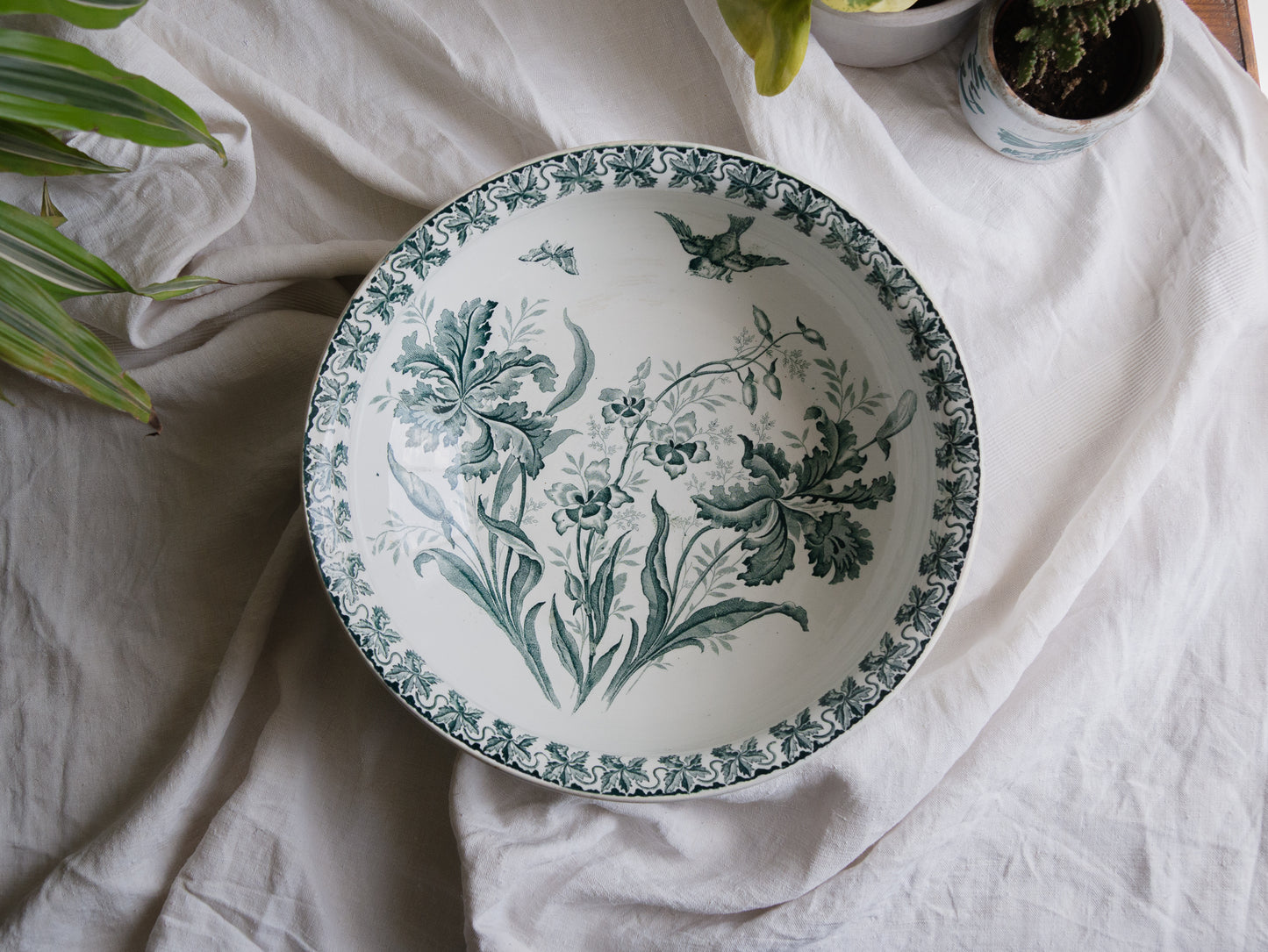 A French antique ironstone jug, basin and soap dish, printed in a soft teal-green bird-and-floral pattern. 