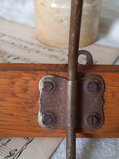 Close-up of a rusty metal hinge on a coat rack