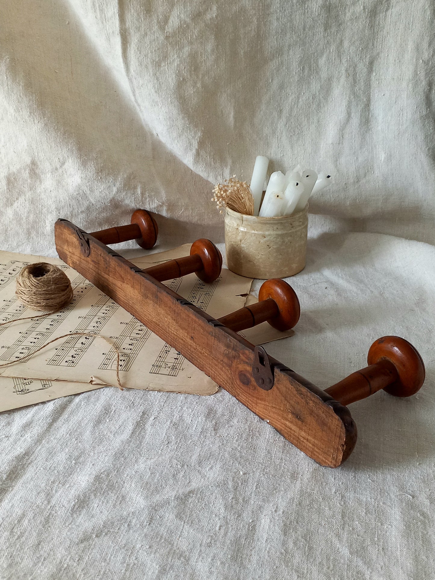 Rear of French Antique Faux Bamboo Coat Rack with Four Pegs in rustic setting.