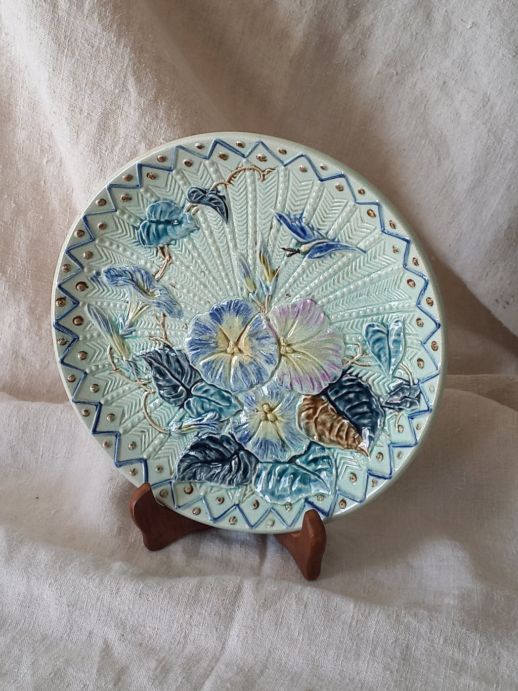 Antique Wasmuel blue floral majolica plate with designs in relief.