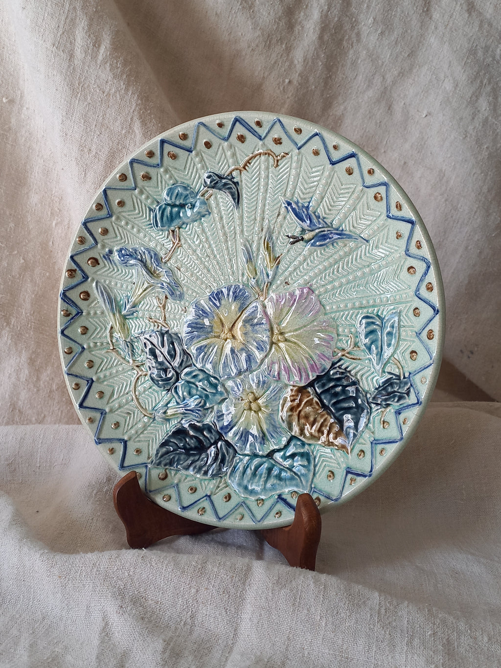 Antique Wasmuel blue floral majolica plate with designs in relief.