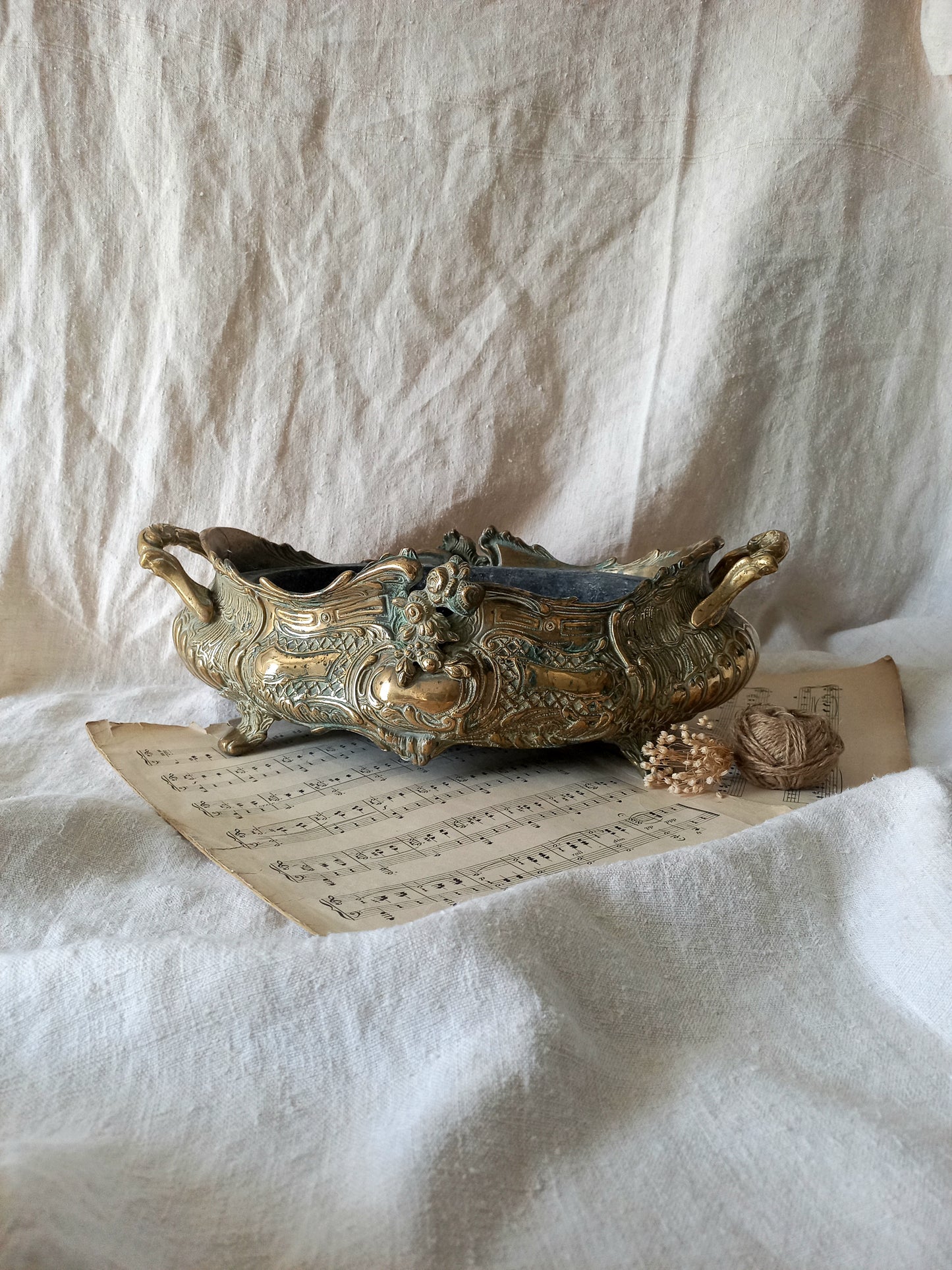 French art nouveau decorative brass planter in a decorative setting.
