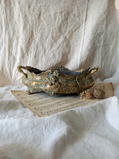 French art nouveau decorative brass planter in a decorative setting.