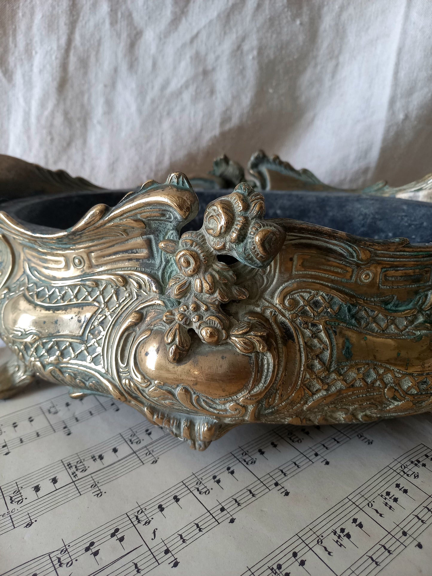 French art nouveau decorative brass planter in a decorative setting.