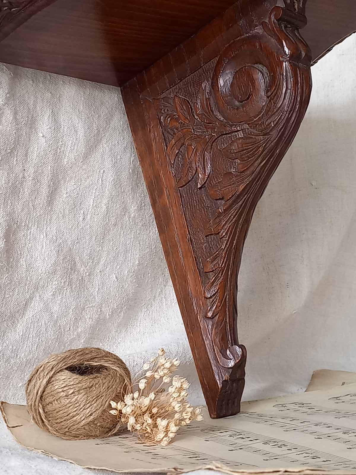Close-up of a French vintage/antique decorative carved wooden wall mounted shelf.