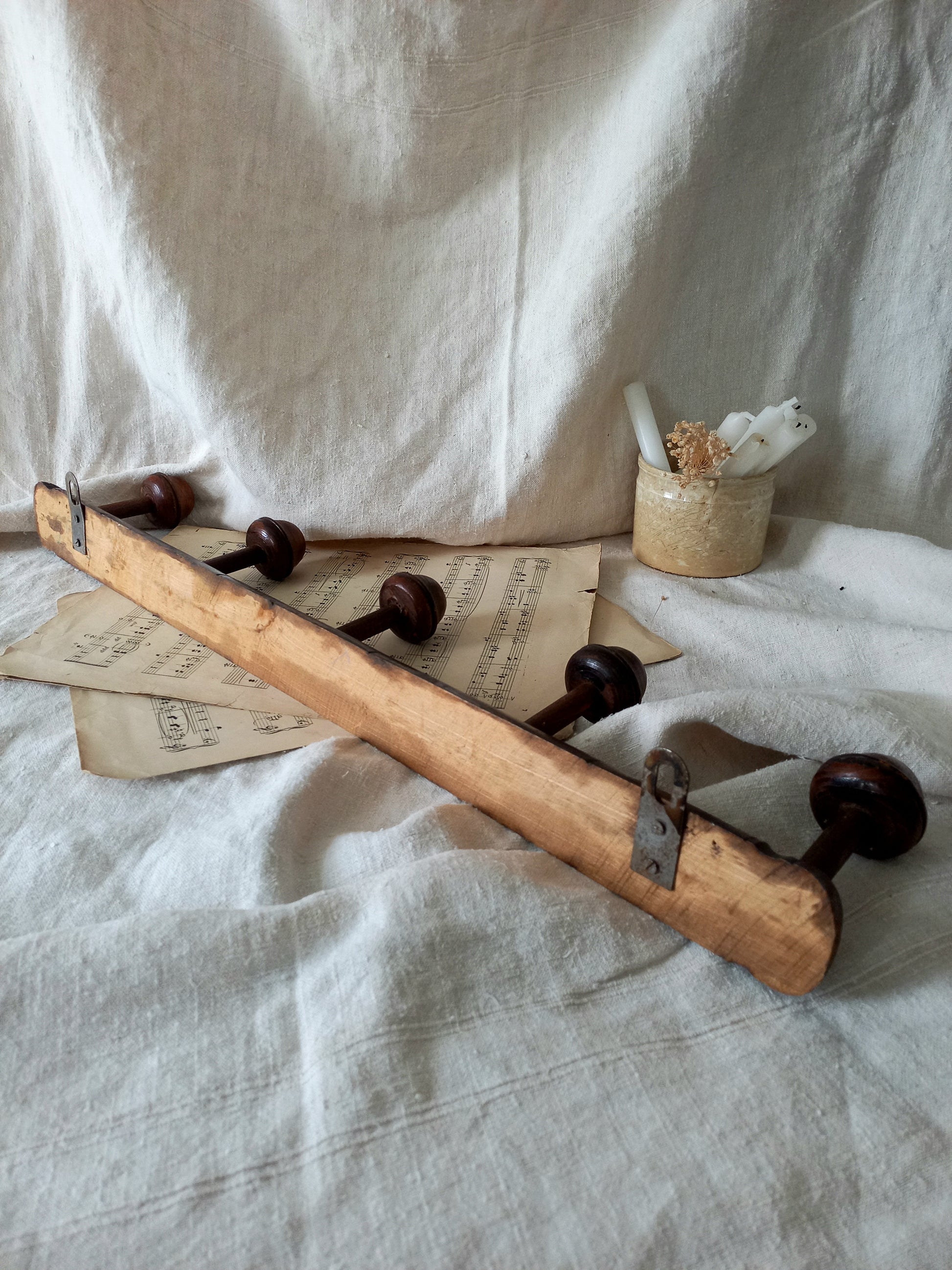 Rear of a French vintage faux bamboo wooden coat rack with 5 hanging hooks/pegs.
