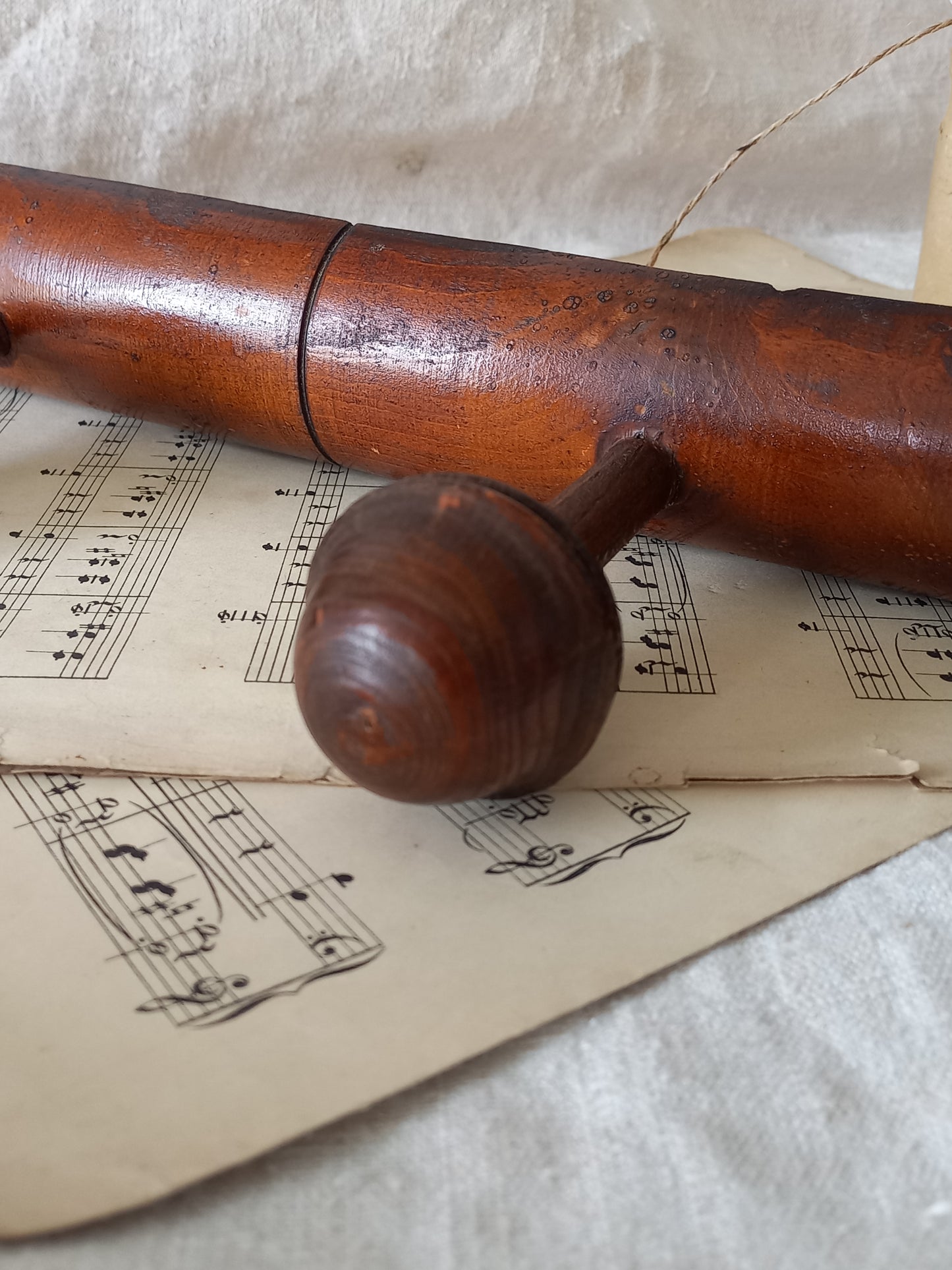 Close-up of a  French vintage faux bamboo wooden coat rack with 5 hanging hooks/pegs.