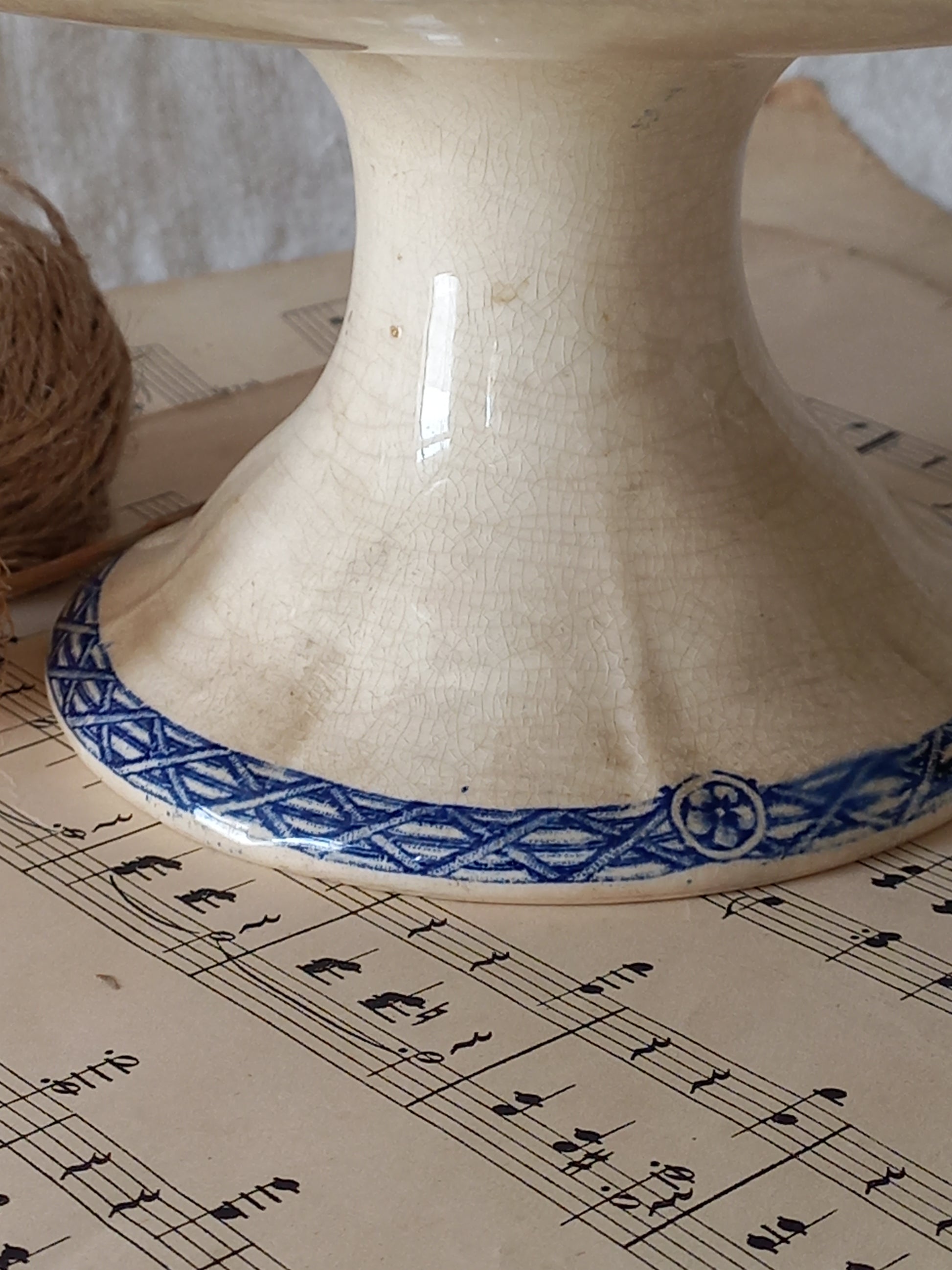 Close-up of a beautiful French antique footed dish/cake stand with a striking dark blue floral pattern made by premier manufacturer Sarreguemines.
