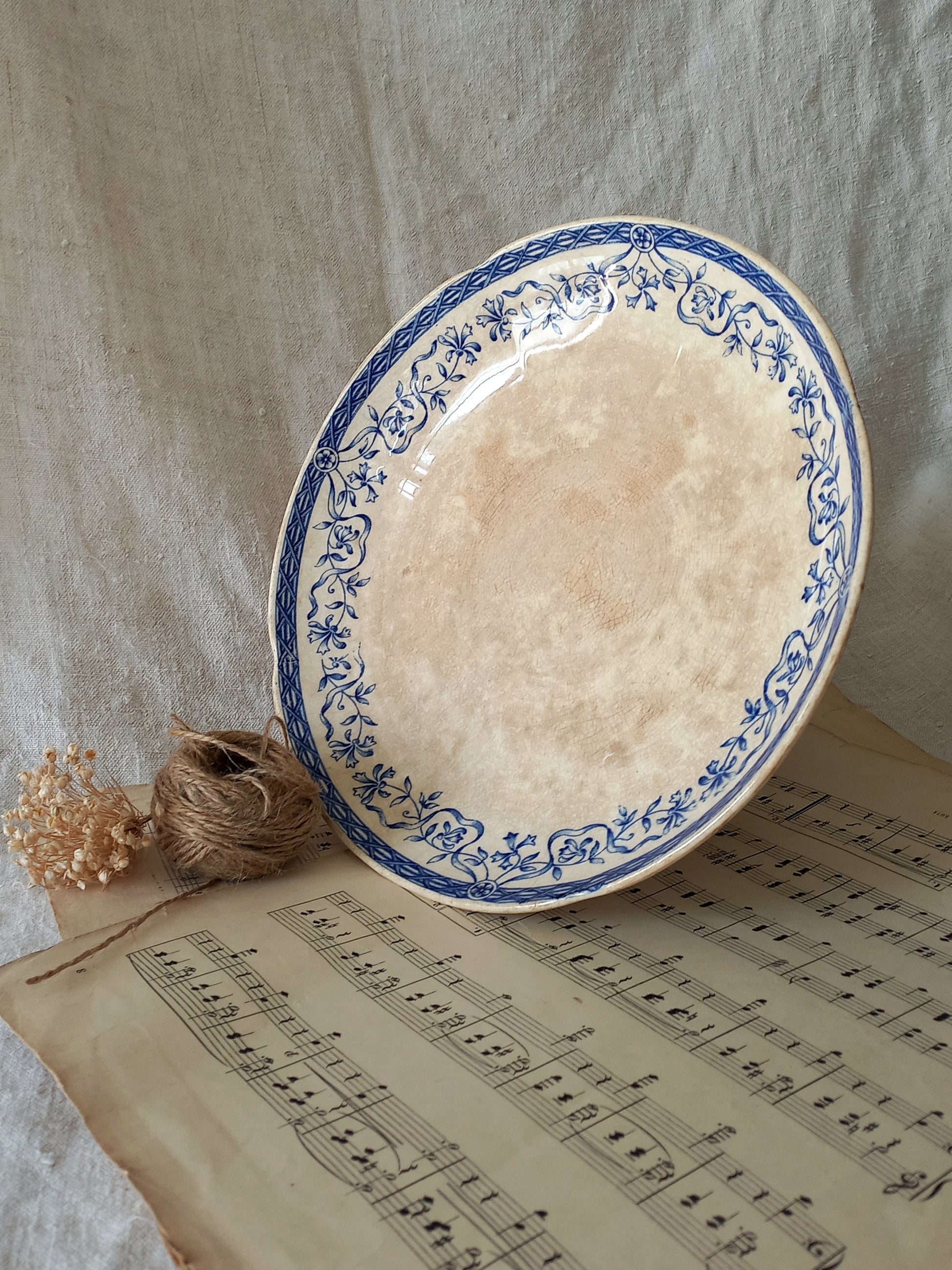 A beautiful French antique footed dish/cake stand with a striking dark blue floral pattern made by premier manufacturer Sarreguemines.
