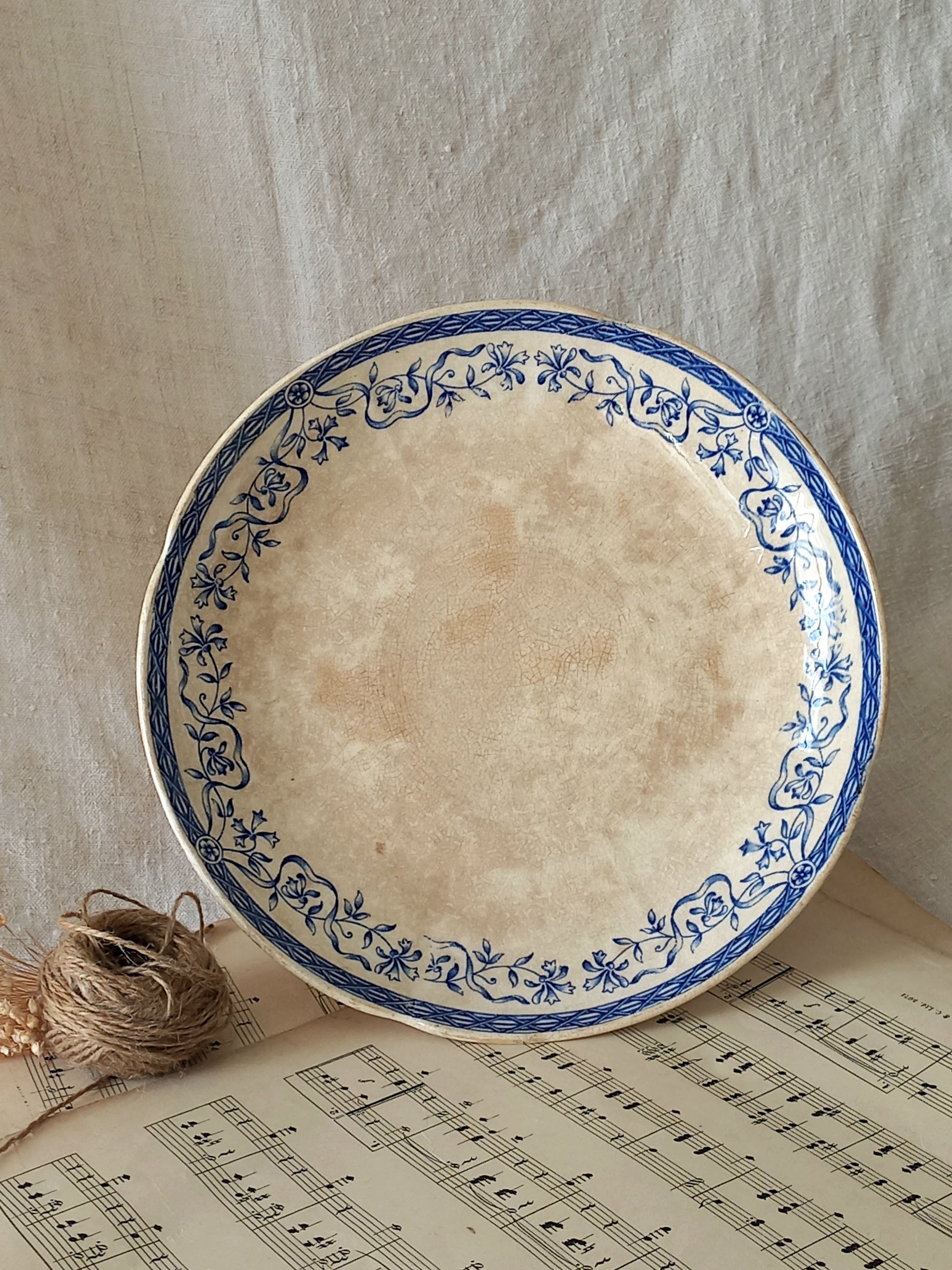 A beautiful French antique footed dish/cake stand with a striking dark blue floral pattern made by premier manufacturer Sarreguemines.
