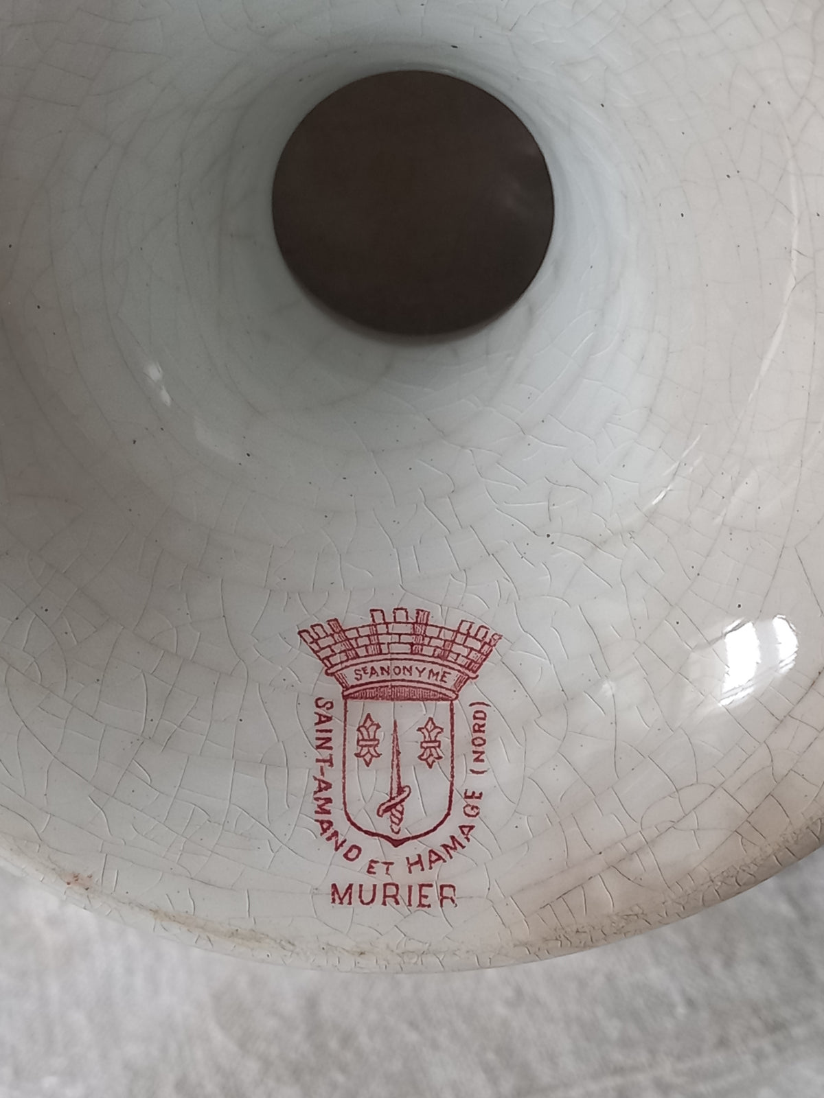 Close-up of maker's mark on a French antique ironstone/earthenware white patinated footed-dish with a pretty burgandy colour floral pattern