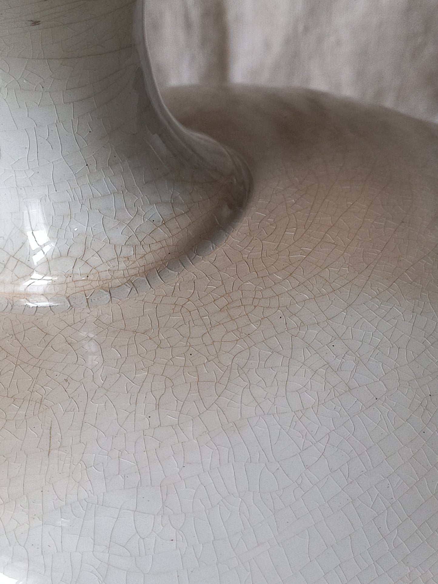 Close-up of a French antique ironstone/earthenware white patinated footed-dish with a pretty burgandy colour floral pattern 