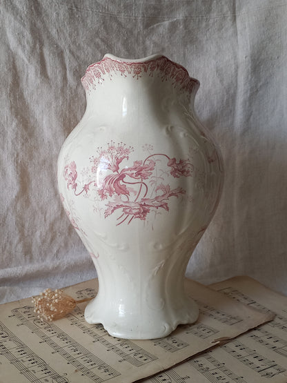 Large French antique ironstone jug in a decorative setting.