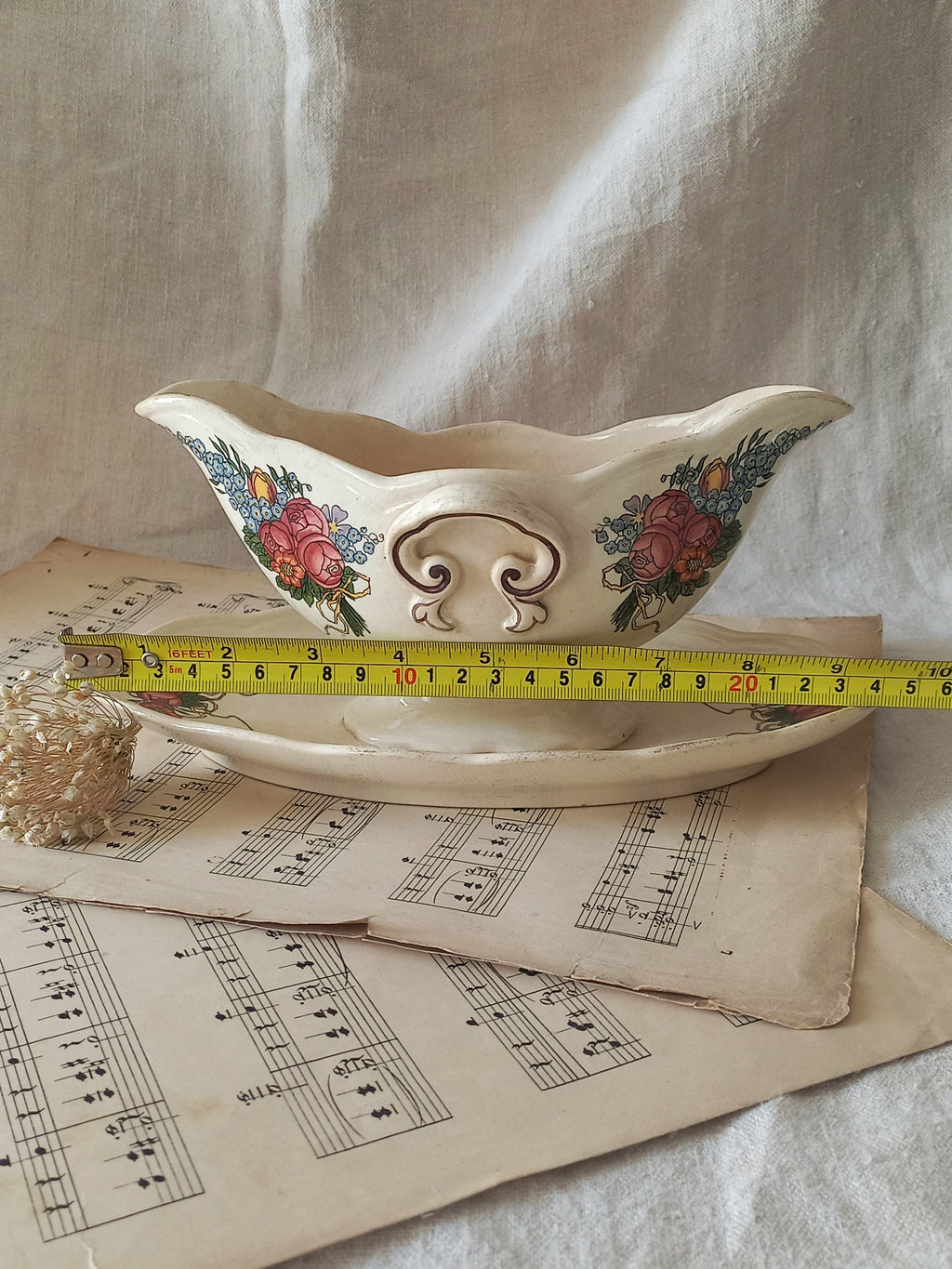 Stunning French vintage ironstone gravy boat with pretty floral patterns. This particular piece of ironstone was manufactured by premier French company, Sarreguemines. 