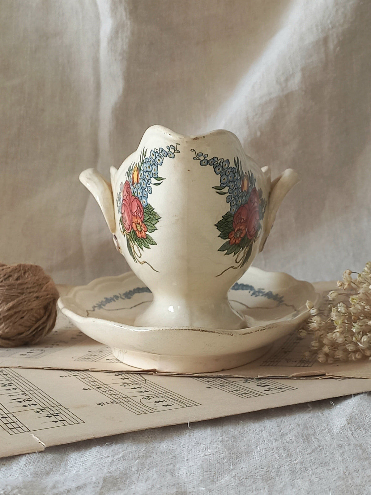 Stunning French vintage ironstone gravy boat with pretty floral patterns. This particular piece of ironstone was manufactured by premier French company, Sarreguemines. 