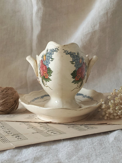 Stunning French vintage ironstone gravy boat with pretty floral patterns. This particular piece of ironstone was manufactured by premier French company, Sarreguemines. 