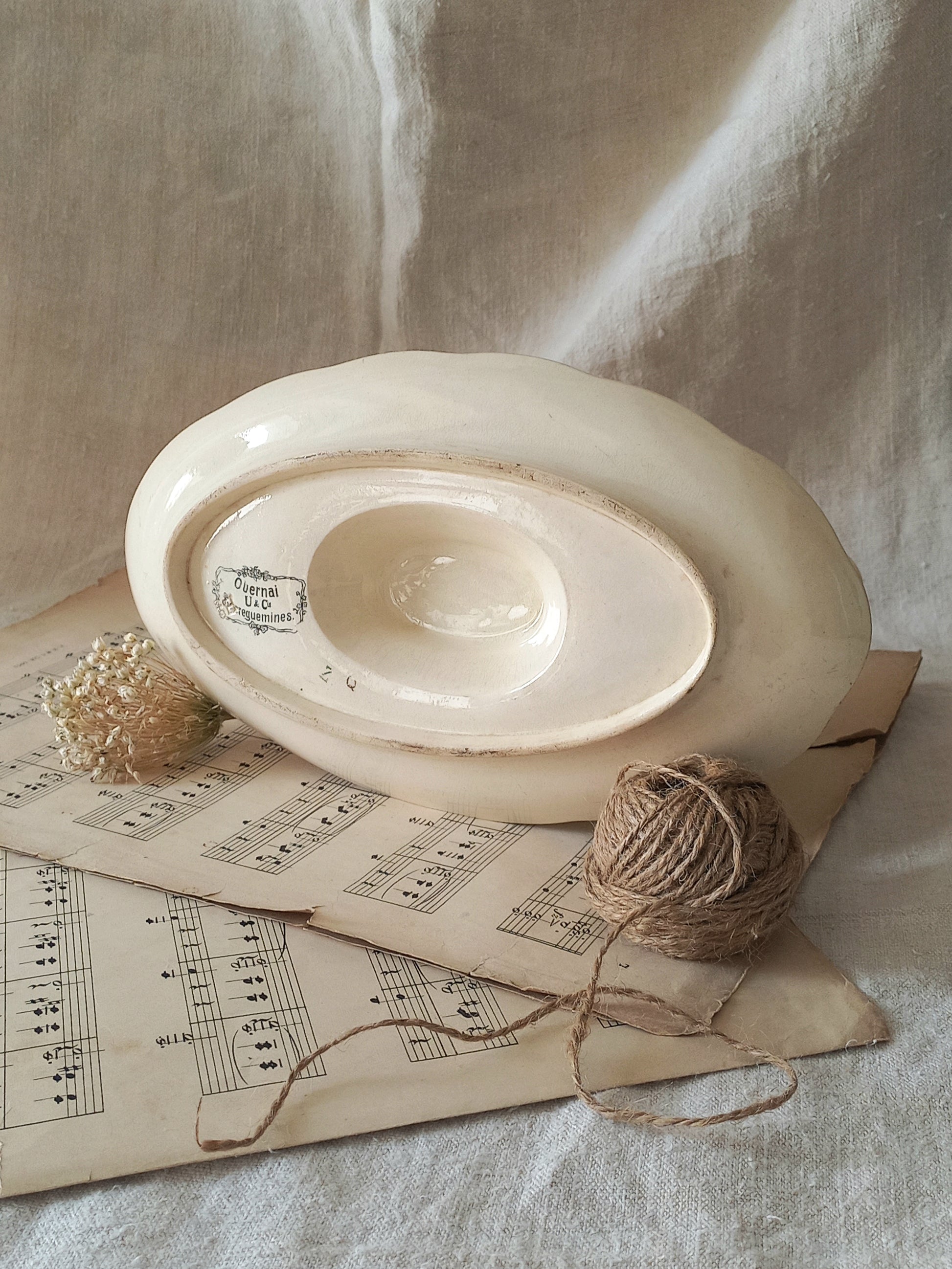 Stunning French vintage ironstone gravy boat with pretty floral patterns. This particular piece of ironstone was manufactured by premier French company, Sarreguemines. 