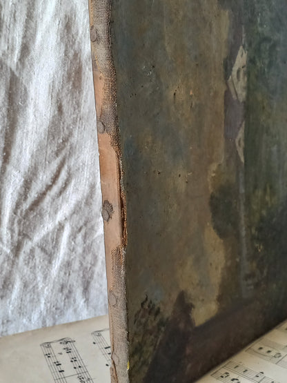 Close-up of the edge of a distressed, antique painting, showing textured paint layers in muted brown, gray, and green tones, standing next to a wrinkled white fabric backdrop.