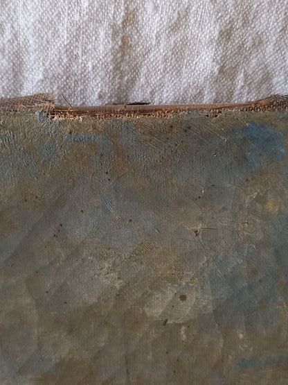 A close-up of a distressed, weathered antique canvas