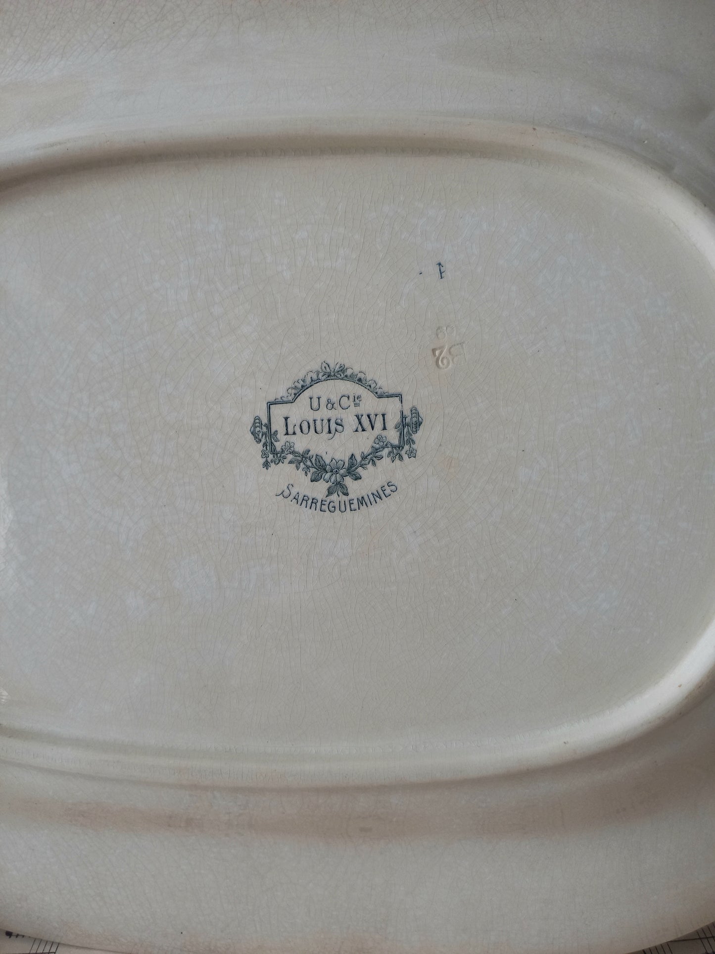 Rear of French antique aged white ironstone plate/platter.