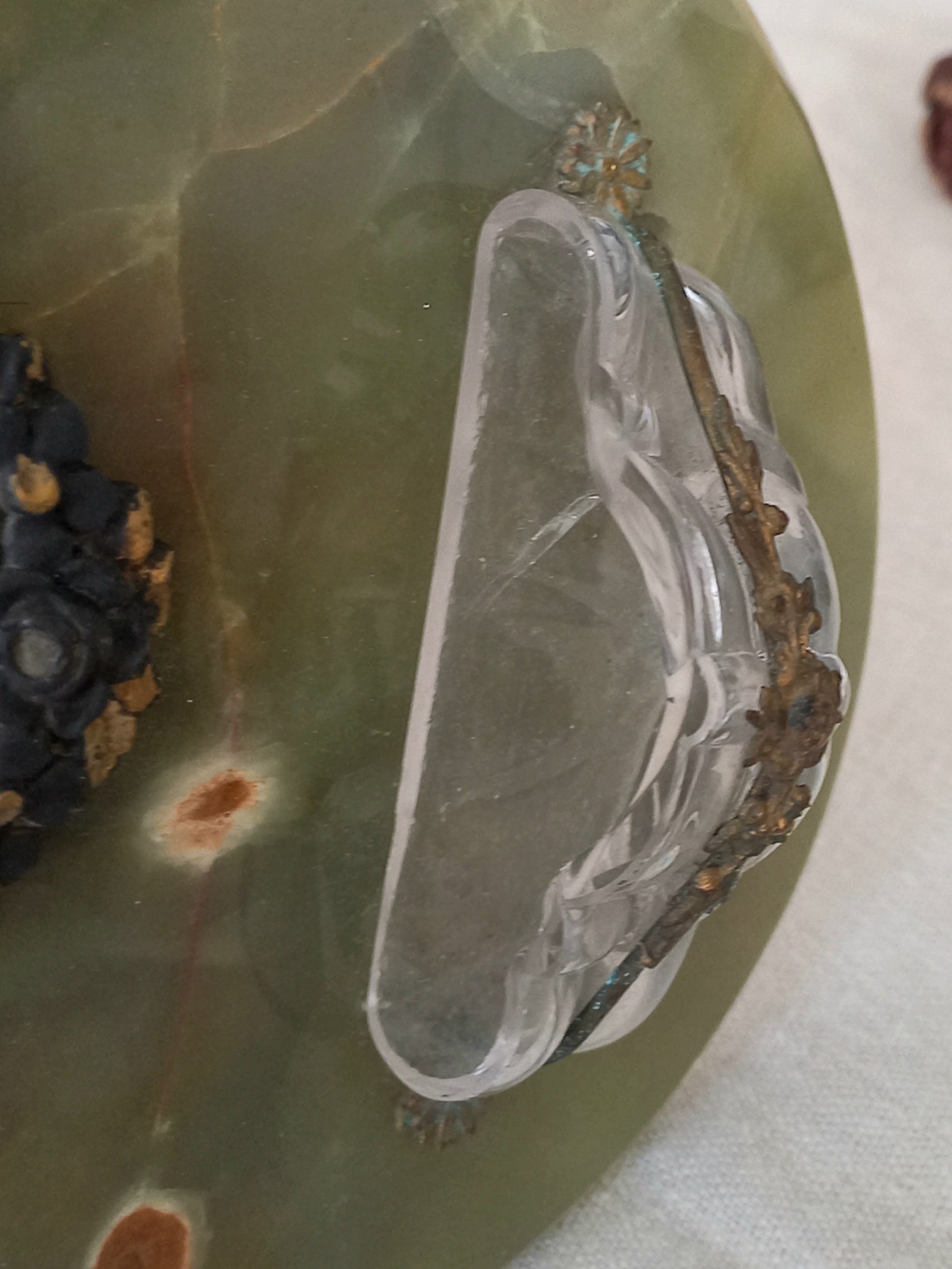 French antique Holy Water font made from onyx with intricate decorative detailing made from metal, a glass water font , and a brass back-plate with a hanging hook.