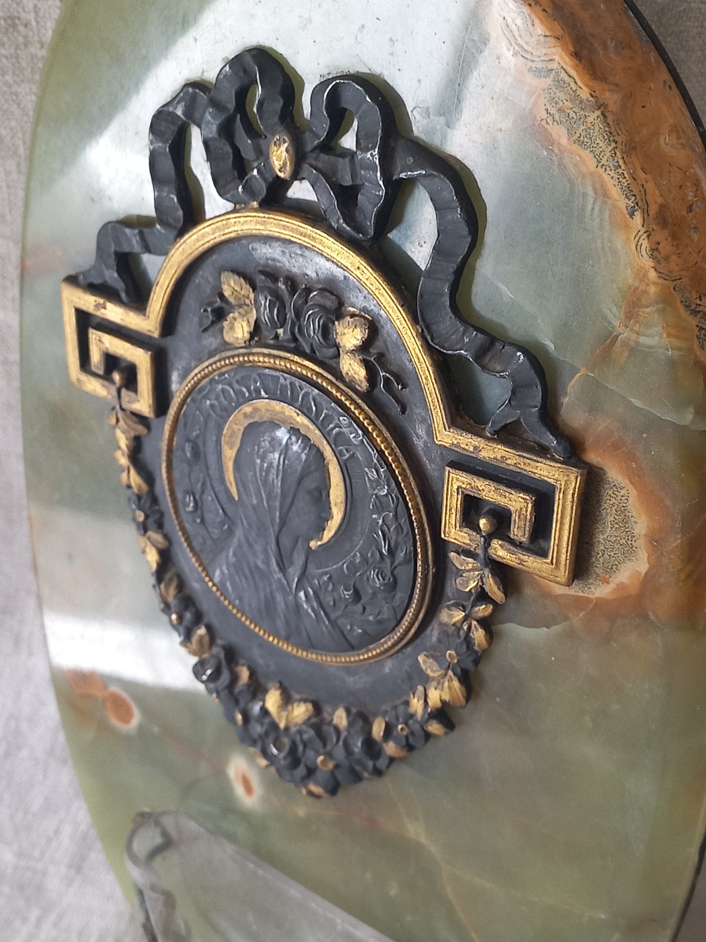 French antique Holy Water font made from onyx with intricate decorative detailing made from metal, a glass water font , and a brass back-plate with a hanging hook.