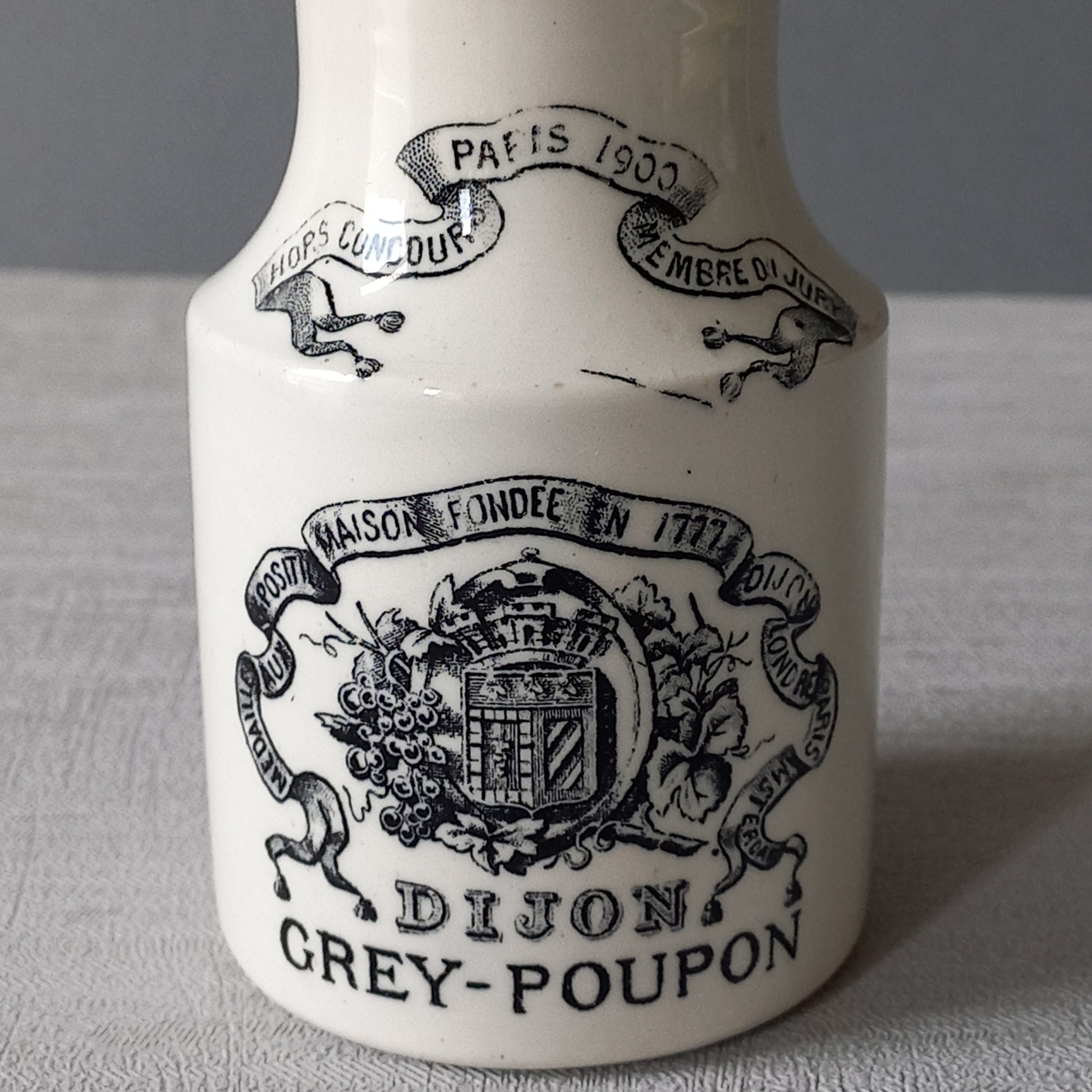 A beautiful French antique white ironstone mustard pot. This wonderful old jar was made by premier French manufacturer Sarreguemines and the maker's mark dates this particular pot as circa. late 1800s to early 1900s