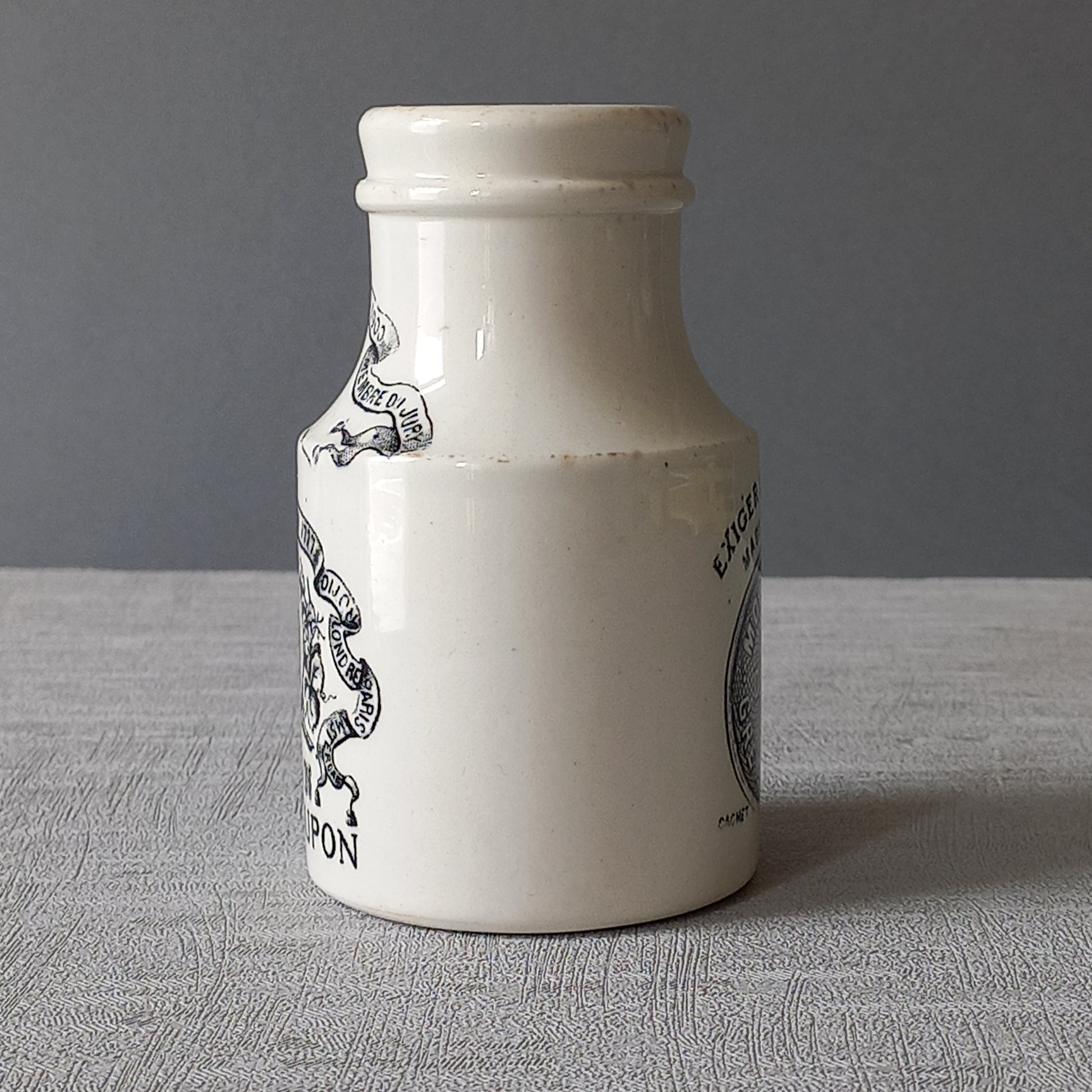 A beautiful French antique white ironstone mustard pot. This wonderful old jar was made by premier French manufacturer Sarreguemines and the maker's mark dates this particular pot as circa. late 1800s to early 1900s