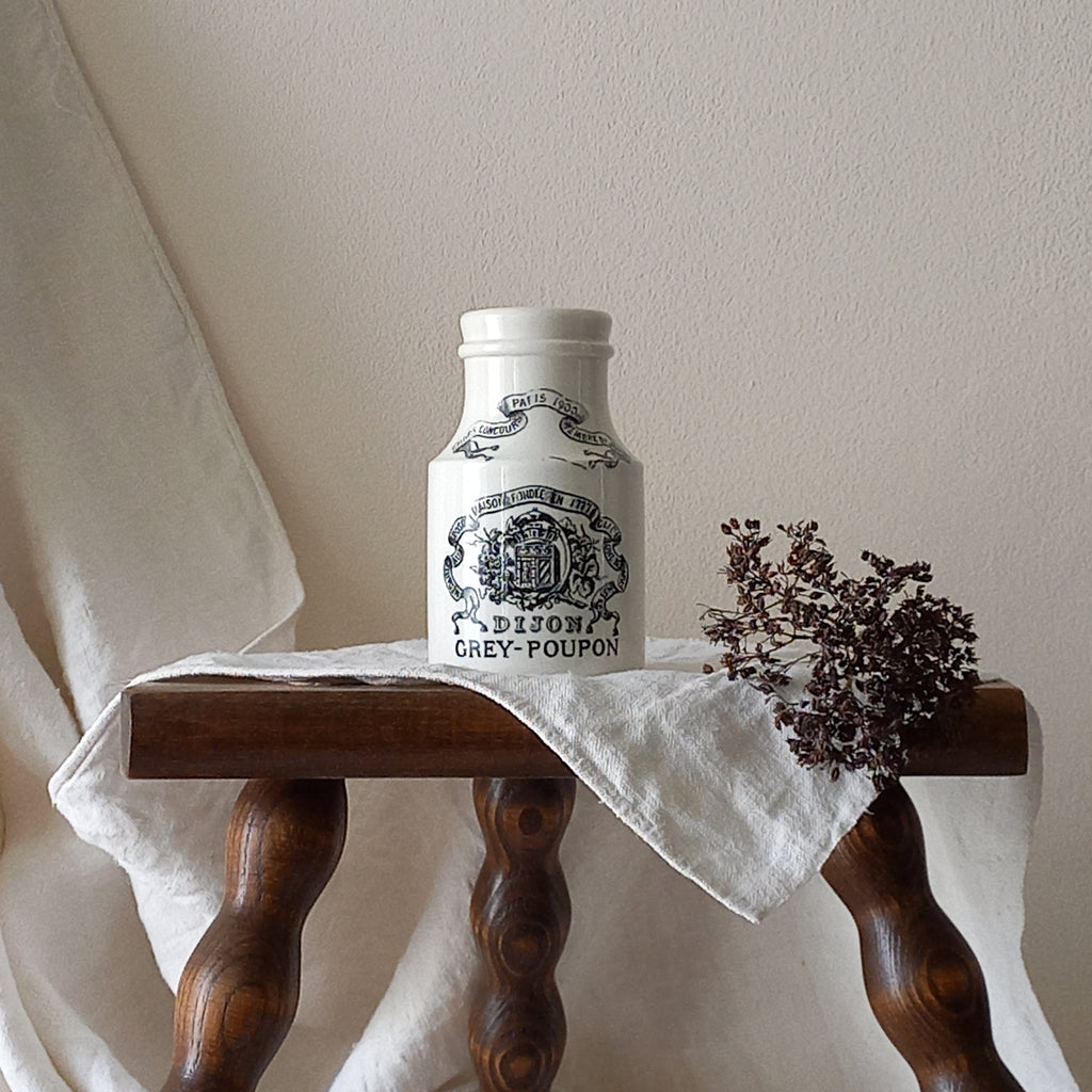 A small antique white ironstone Dijon Grey-Poupon mustard pot made by premier French manufacturer Sarreguemines. These little pots are very collectible and make wonderful pieces of home decor.